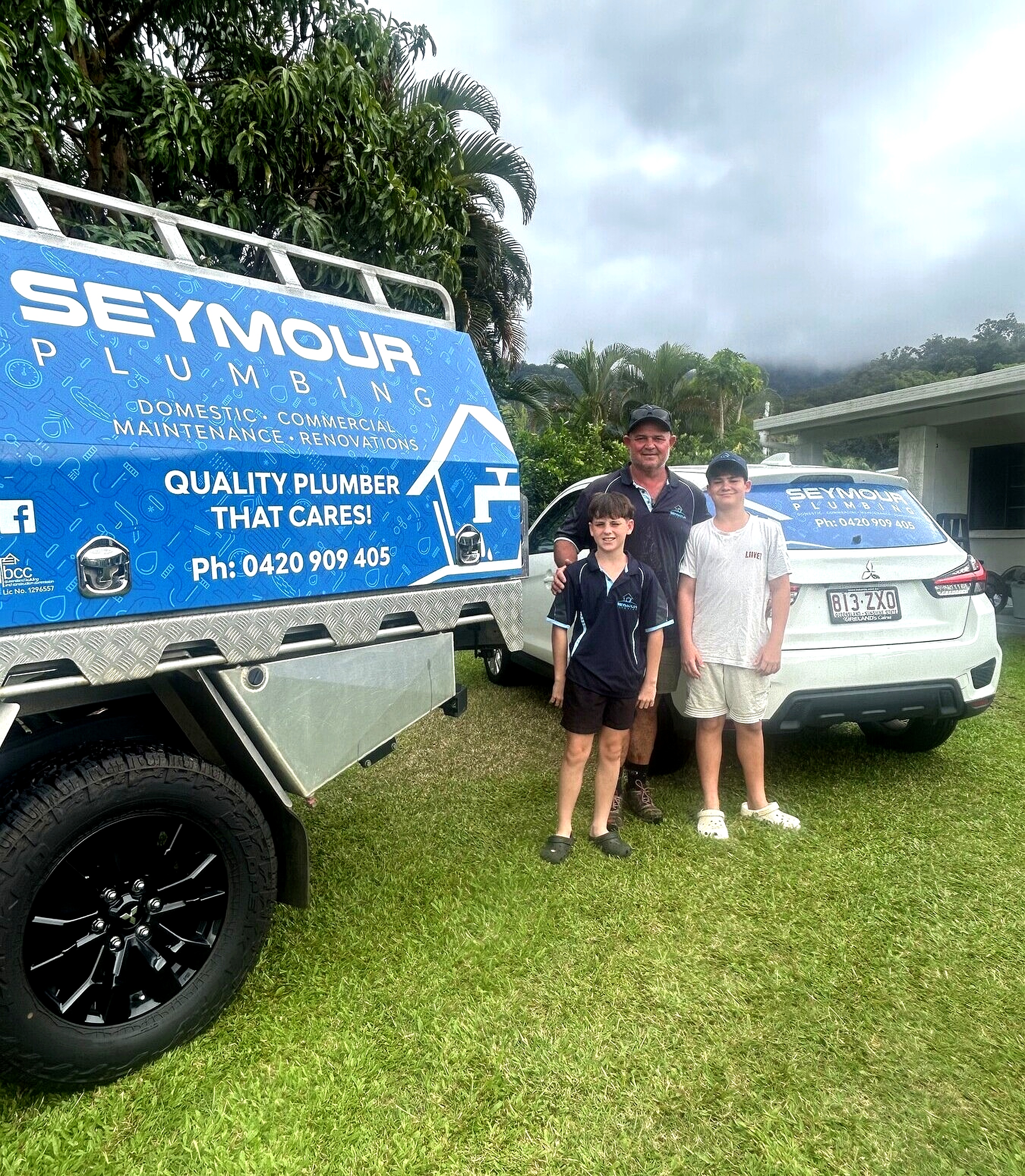 Ryan Seymour and his family in front of the Seymour Plumbing work vehicle