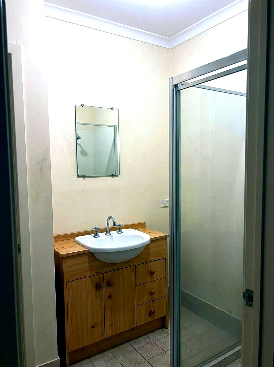 Before — Vanity with Fluted Tile Feature — Bathroom Renovations by Seymour Plumbing